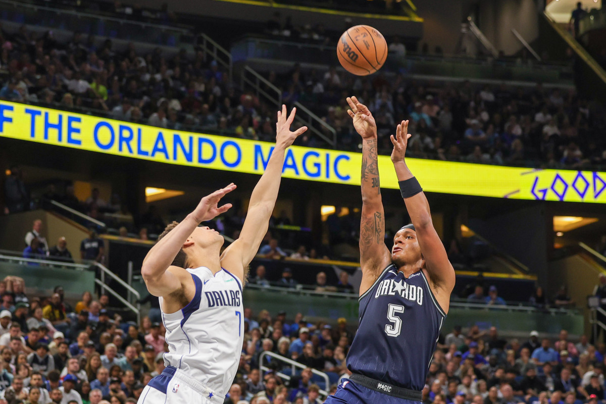 Orlando Magic forward Paolo Banchero (5) shoots the ball against Dallas Mavericks center Dwight Powell (7) during the second half at Amway Center.